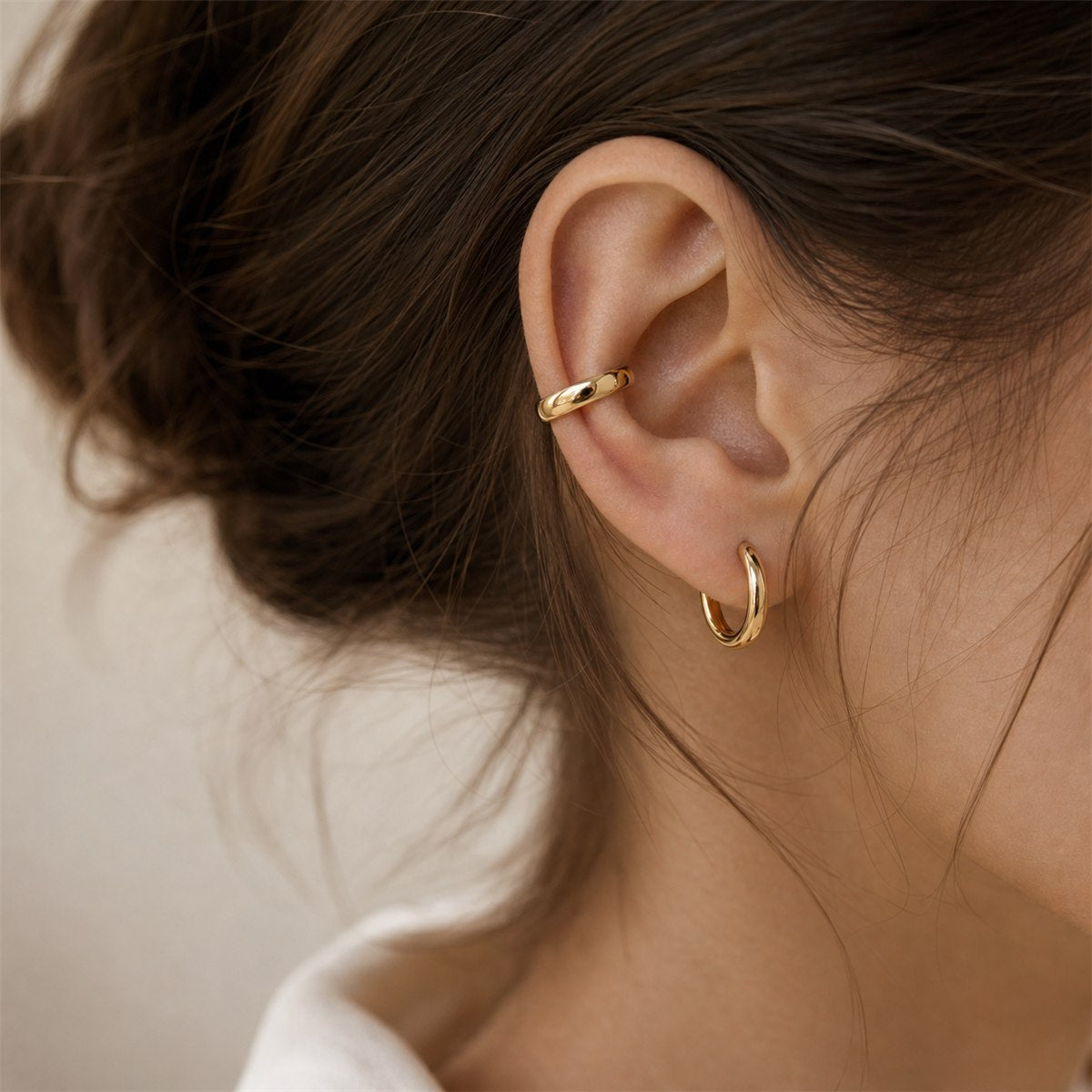 Gold hoop earrings editorial detail